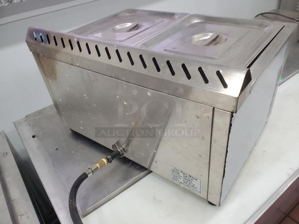 Gas Bain Marie QRTC-2T made of stainless steel with liquid propane connection. Features two compartments and visible usage wear.