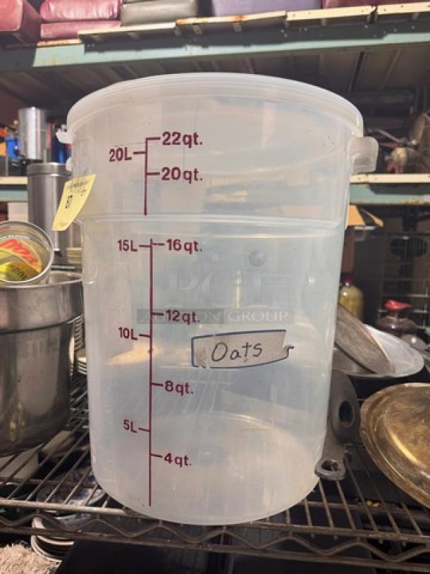 22Qt clear food storage container with red measurement markings up to 22 quarts. Label reads "Oats." Good condition.