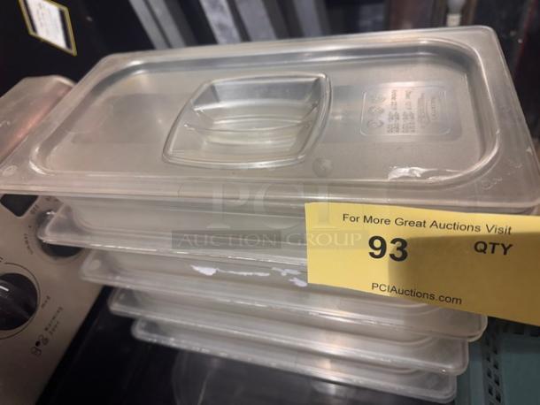 1/3 x 2.5in food pan with lid, clear plastic, stackable, pristine condition. Tag indicates auction lot number 93.