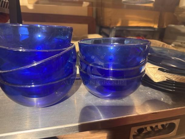 Lot of blue glass cereal bowls and plates, excellent condition, glossy finish, sold as one set.