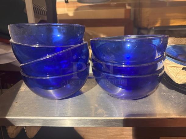 Lot of cobalt blue glass cereal bowls and plates; good condition; stackable set.