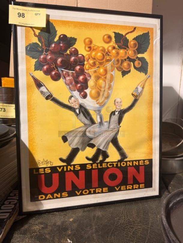 Vintage framed print of "Les Vins Selectionnés Union," featuring two men with wine bottles and grapes, colorful design.