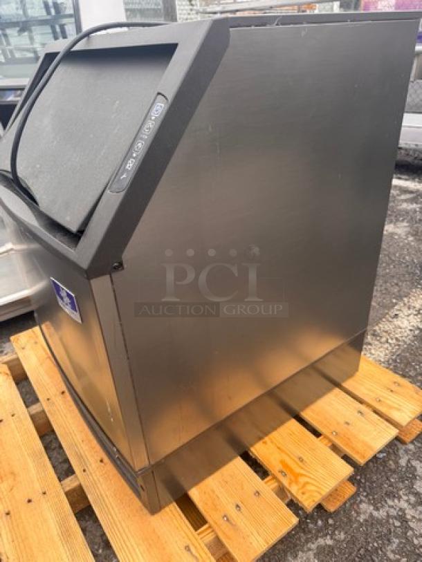 Manitowoc UYF014A-161B Icemaker, 115V, stainless steel, excellent condition, shown on a pallet, control panel visible.