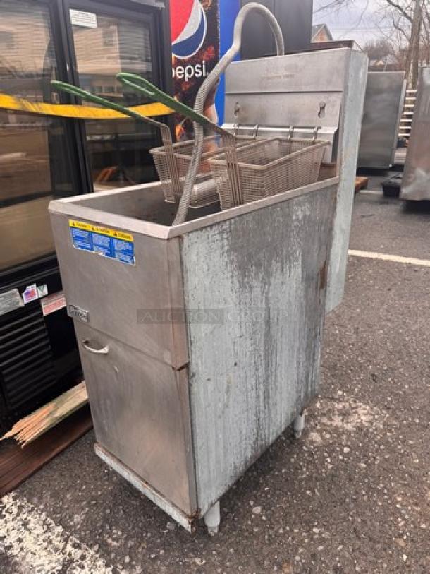 Pitco Natural Gas 35 lbs floor model fryer, model 35C+S, with 2 baskets. Visible wear, industrial setting.