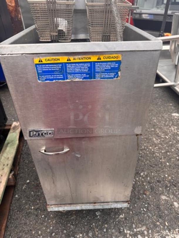 Pitco 35C+S natural gas floor fryer, 35 lbs capacity, includes 2 baskets, metal exterior, visible caution label, used condition.