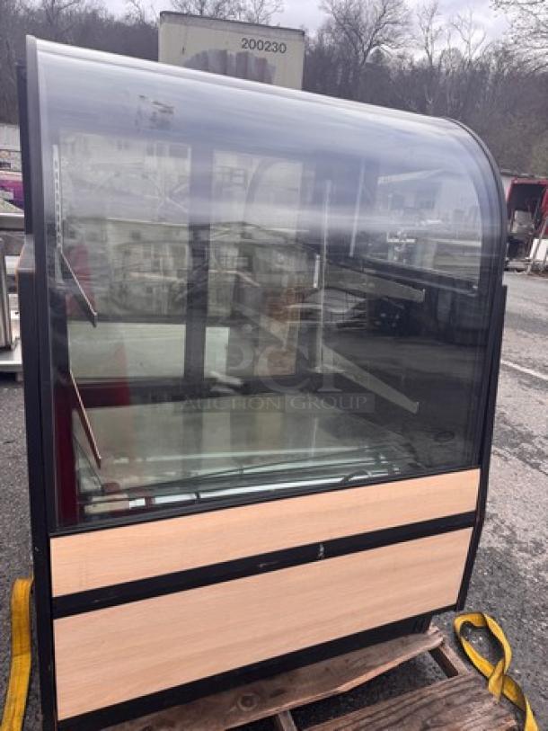 Federal CGR3652 Refrigerated Display Case, curved glass front, black trim, wood paneling, on pallet, used condition.