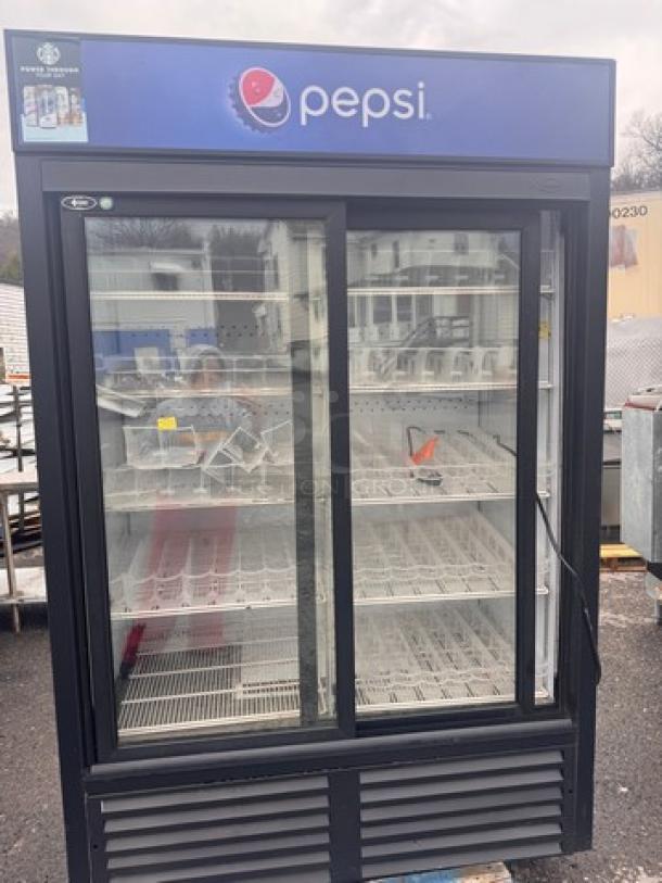 QBD CD45-HC Cooler merchandiser with Pepsi branding, glass doors, adjustable shelves, and visible interior lights; in used condition.