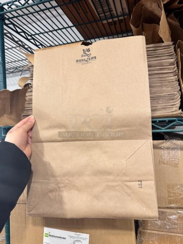Brown 1/6 paper bag with "DURO" branding and "DUALIFE" marking, shown in-hand on storage shelving.