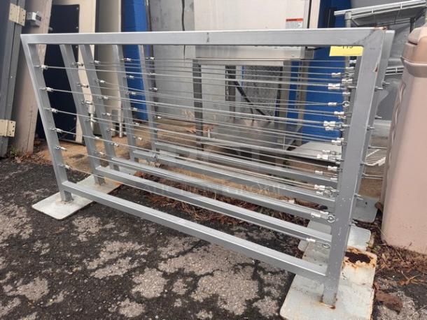 Metal cable railing/fence BIDX5, sturdy metal construction, horizontal cables, rectangular frame, outdoor condition.