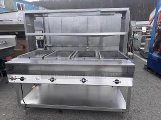 VOLLRATH 4 Bay steam table with overhead shelf, model 38004, 120V. Notable dent on one side. 