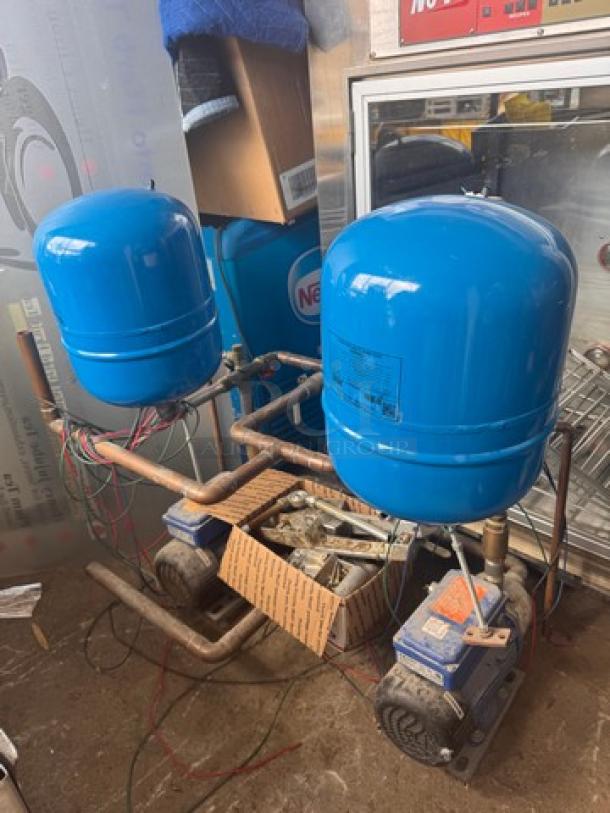 Blue HYDRO-PNEUMATIC PUMP TANK V15P 100 with visible wiring and piping, in used condition, featuring dual pump setup.