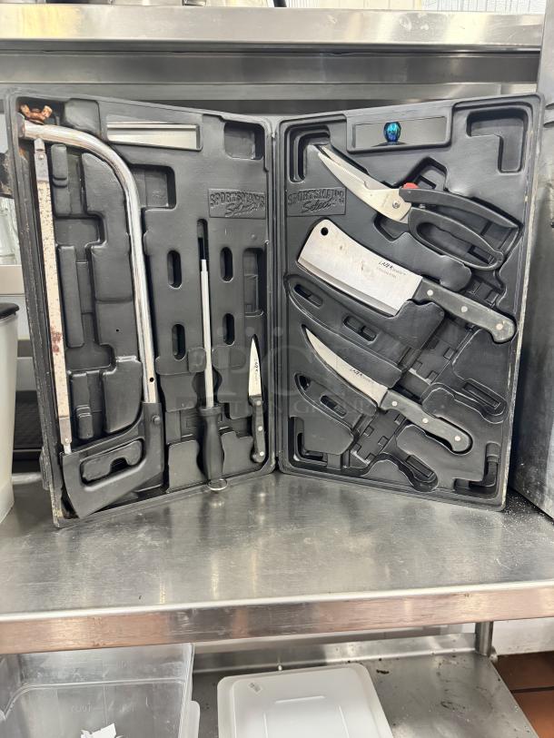 Knife set in black case featuring cleaver, shears, and sharpening tools. Brand "Sportsman’s Select" visible. Used condition.