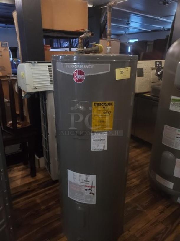 Rheem Performance 50 Gal. 4500-Watt electric water heater in good condition, labels show energy efficiency rating and model details.