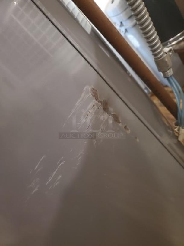 Rheem Performance 50 Gal. electric water heater with visible scratches and rust on the side; 4500-Watt model.