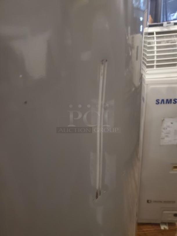 Rheem Performance 50 Gal. 4500-Watt Electric Water Heater, visible dent, gray exterior, minor surface blemishes.