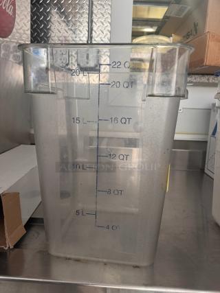 Clear 22QT storage food container with measurement markings, used condition, square shape, suitable for kitchen storage.