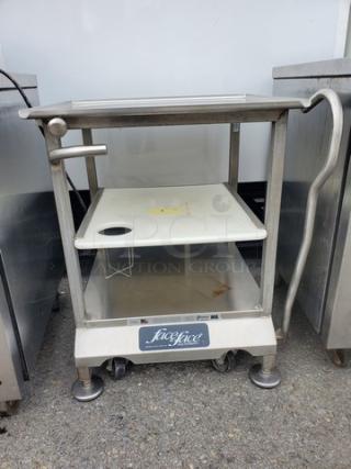 Stainless steel slicer stand/work table with wheels, lower shelf, and handle. Features Licefice branding on the front panel.