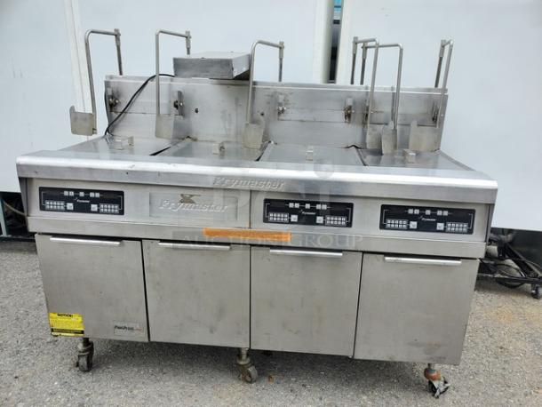 Frymaster FMPH355BLSC NG fryer, stainless steel, multi-basket, well-used condition, branded control panels visible.