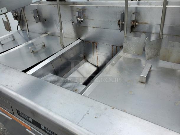 Frymaster FMPH355BLSC NG Fryer, stainless steel, natural gas, multiple fry baskets, pre-owned, visible wear and stains.