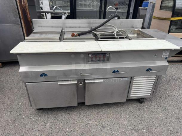 H&K International hot dog steamer stand, stainless steel, good condition, features multiple compartments, dials, and storage.