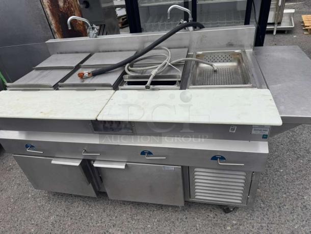 H&K International hot dog steamer stand, stainless steel, dual compartments, integrated sink, and storage, used condition.