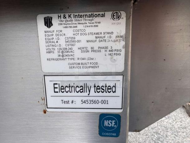 H&K International Hot Dog Steamer Stand with labels showing electrical specs, NSF certified, and model details.