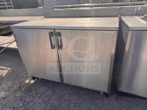 DUKE RUF-48 48" undercounter refrigerator, stainless steel, dual doors, used condition, slight surface wear visible.
