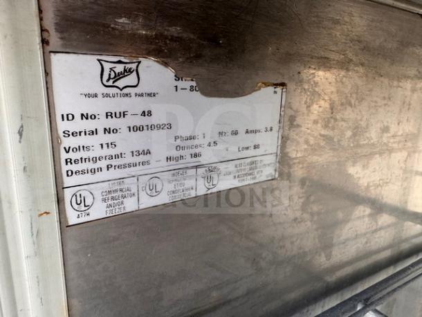 DUKE RUF-48 48" Undercounter Refrigerator label showing model, serial number 10010923, voltage, and refrigerant details.