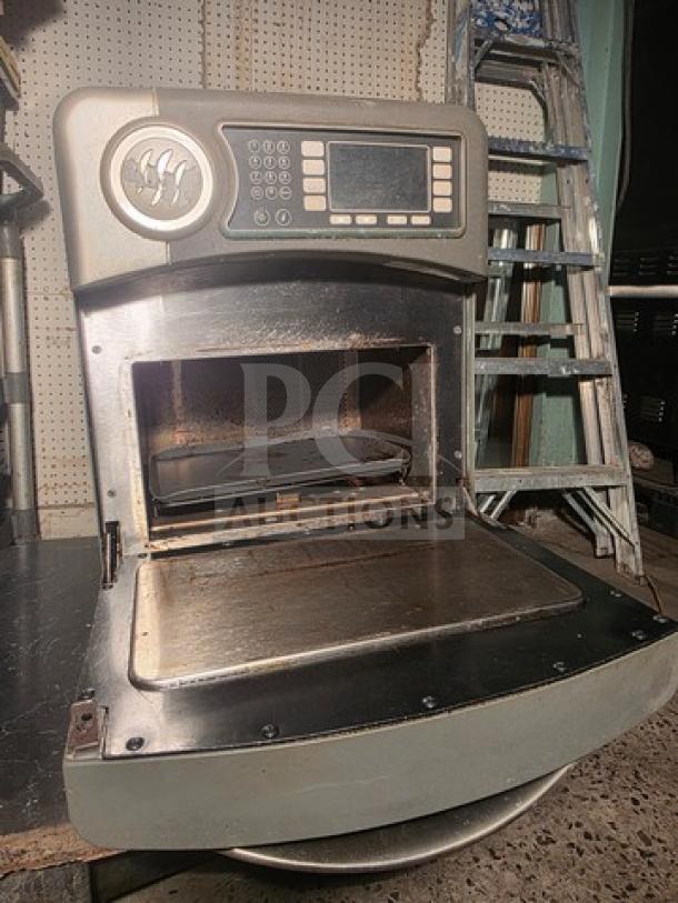 Turbochef NGO high-speed countertop oven, open view. Features digital controls, stainless interior. Slightly used condition.