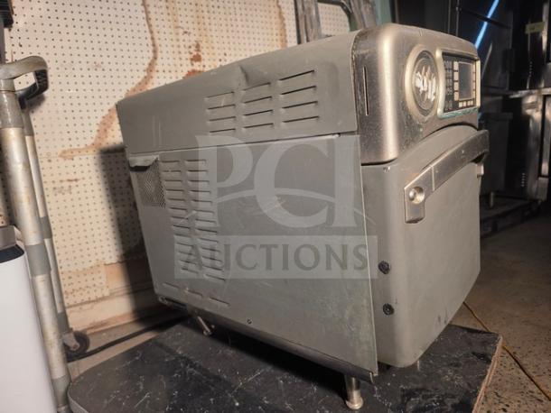 Turbochef NGO high-speed countertop oven in used condition, with visible control panel and venting, offers rapid cooking capabilities.