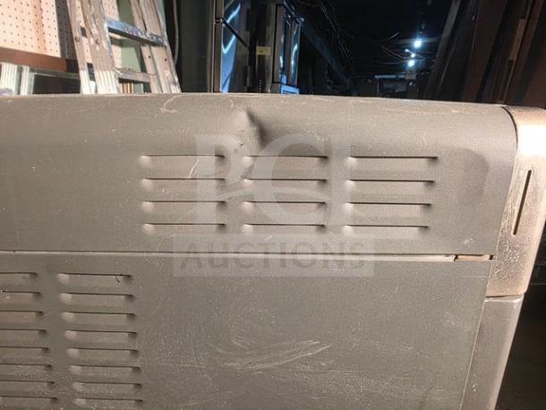 TURBOCHEF NGO high-speed countertop oven, visible dent on side panel, signs of wear; model NGO in fair condition.