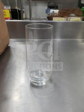 Clear Tall Hi-Ball Glass BIDX20, cylindrical shape, excellent condition, placed on a stainless steel surface.