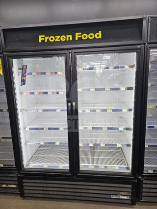 TRUE two glass door freezer merchandiser, tested and working, LED interior lighting, adjustable shelves, black exterior.