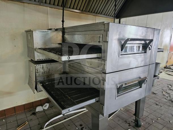 Lincoln Impinger single stack conveyor oven, stainless steel, dual compartments, visible wear, ideal for commercial kitchens.