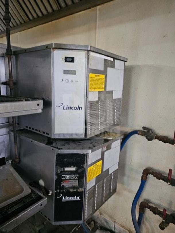 Lincoln Impinger single stack conveyor oven, stainless steel, with control panel, visible branding, labels, and operational instructions.