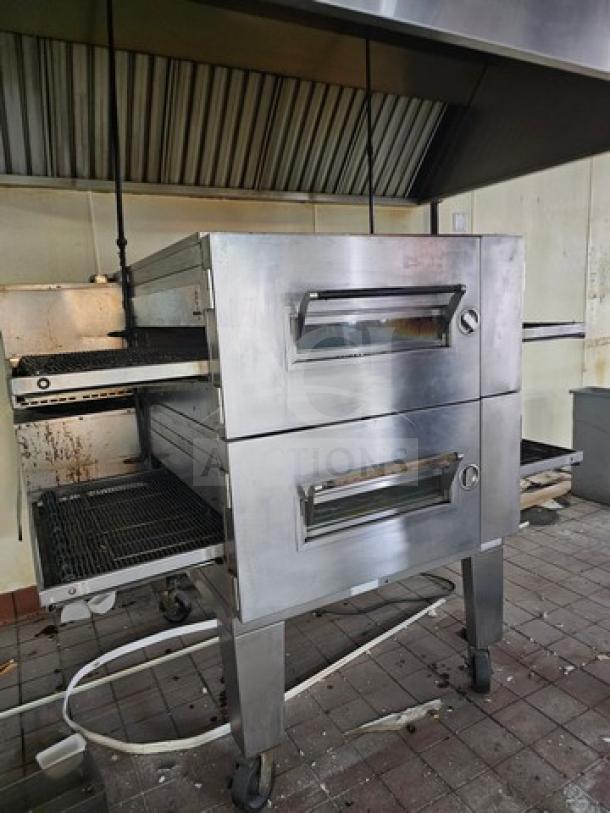 Lincoln Impinger single stack conveyor oven, stainless steel, dual doors, on casters, used condition.