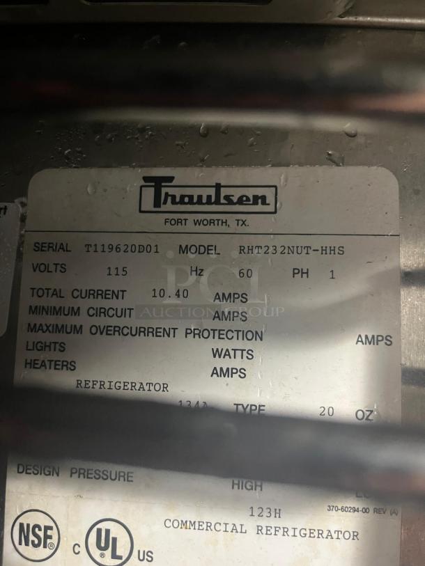 Traulsen RHT232NUT-HHS refrigerator label showing model, volts 115, and serial T119620D01. Commercial use, NSF and UL rated.