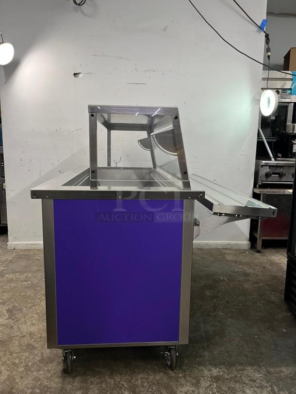Delfield SCSC-60-EFP 60" refrigerated prep table, stainless steel, glass hood, on casters, excellent condition.