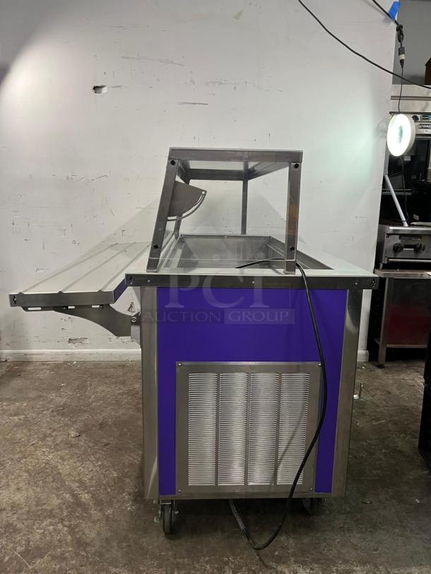 Delfield SCSC-60-EFP 60" refrigerated food prep table. Stainless steel with purple accents. Includes hinged cover.