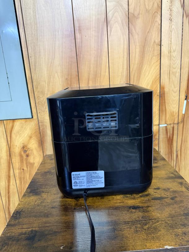 Instant Pot Vortex Plus 10 Quart Air Fryer Oven, black, model VORTEX PLUS, rear view showing ventilation and power cord, good condition.