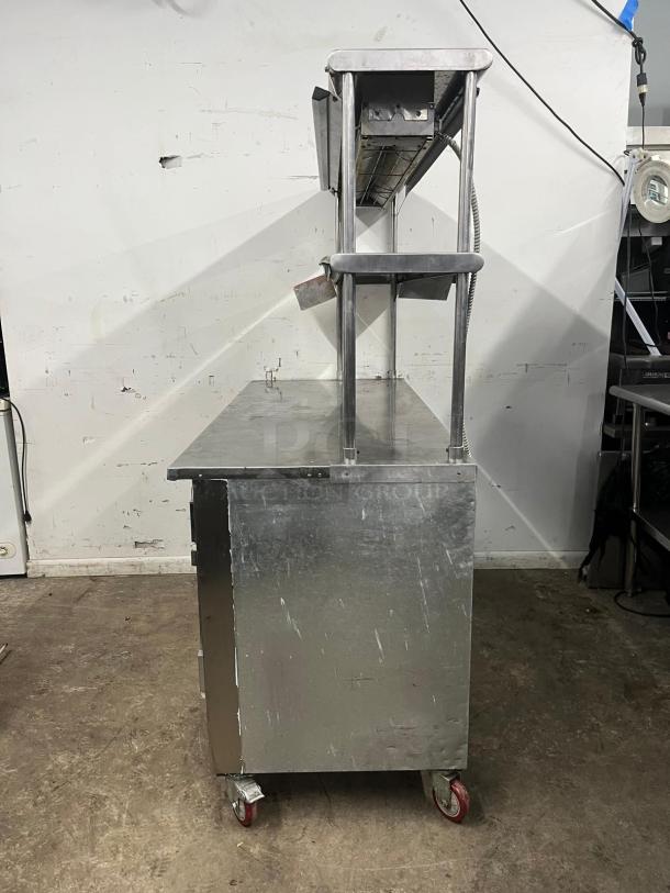 LEADER LB48 under counter refrigerator, 48", with two full and half doors, double shelves, heat lamp, used condition.