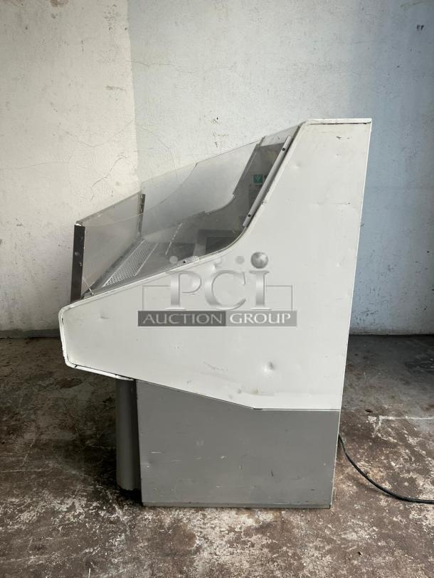 Grab & Go open top display cooler in steel/white, tested and working, side view showing wear, with power cord visible.