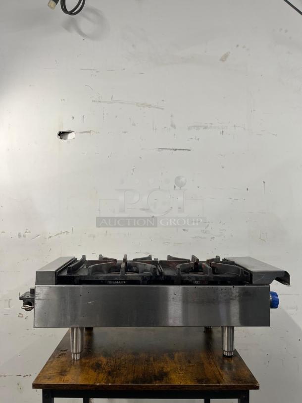 Imperial IHPA-2-12 gas hotplate with two 32,000 BTU/hr cast iron burners. Features PyroCentric™ technology for even heating.