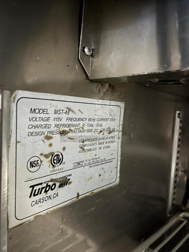 Turbo Air MST-48 M3 Series 48in prep table, model label shows voltage 115V, frequency 60Hz, refrigerant R-134a.