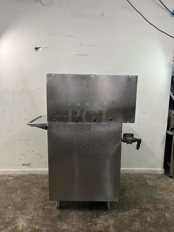 Magikitch'n gas countertop charbroiler, manual control, 195,000 BTU, stainless steel, appears in used condition.