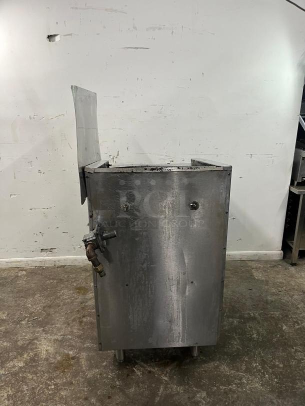 Magikitch'n gas countertop charbroiler, manual control, 195,000 BTU, stainless steel, used condition, industrial setting.