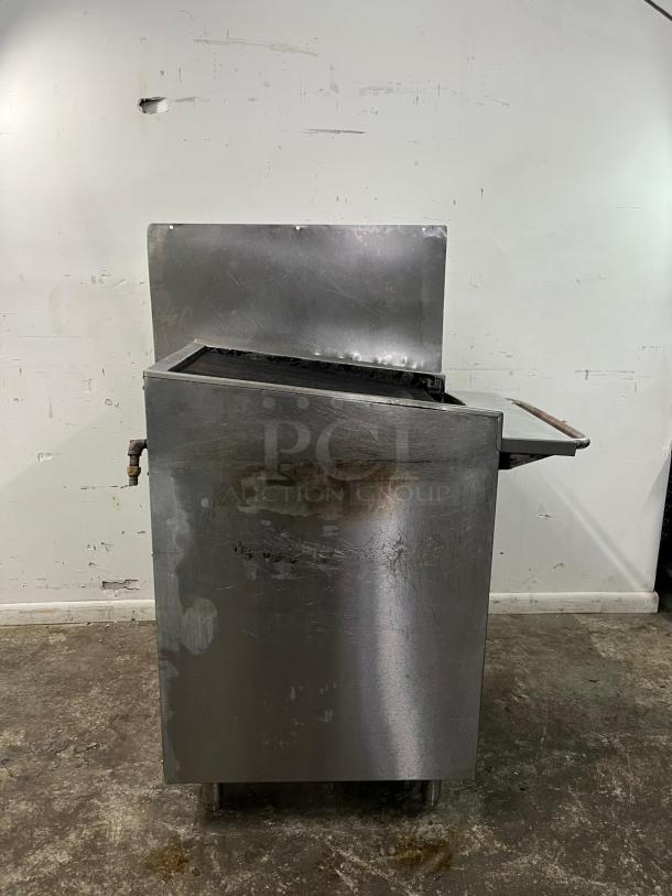 Magikitch'n gas countertop charbroiler, 195,000 BTU, manual control. Stainless steel, visibly used condition, slight rust.