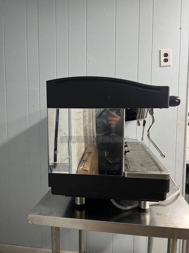 FAEMA E98 RE espresso machine, late model, sleek design, appears in good condition, with visible steam wand and drip tray.