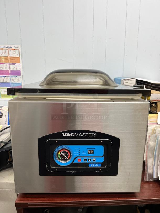 VacMaster VP320 chamber vacuum sealer, stainless steel, with 16" seal bar and digital controls, in good condition.