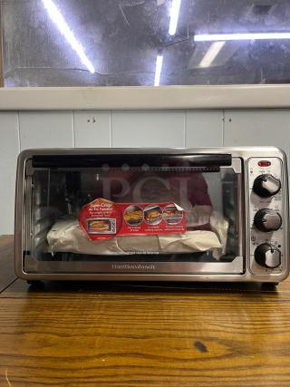 Hamilton Beach 8-Mode Sure-Crisp Air Fry Toaster Oven, model TOASTER OVEN, in excellent condition, featuring air fry function and 4 cooking options.